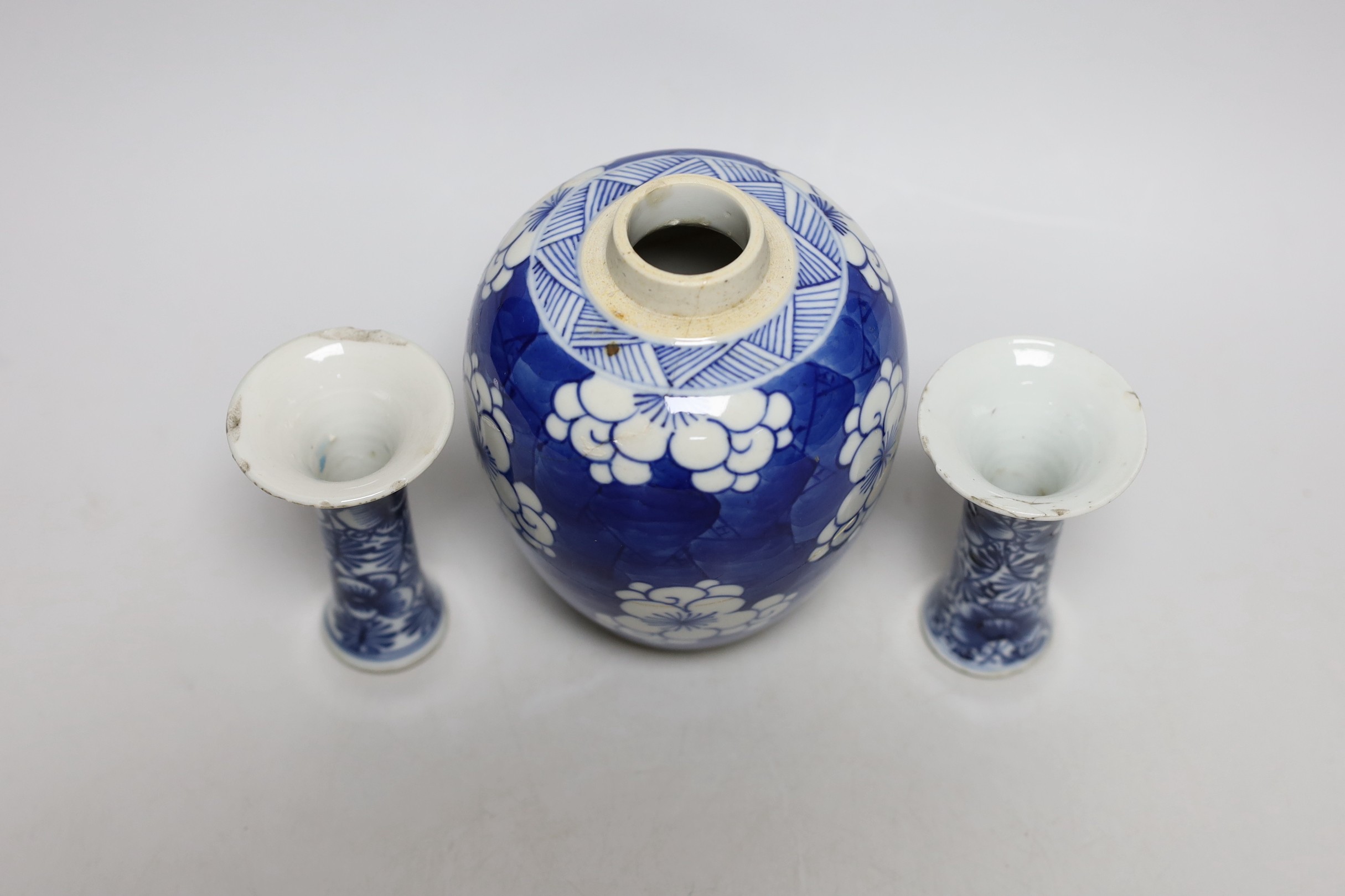 A Chinese blue and white prunus jar, two miniature vases and a dish, all Kangxi period, jar 14cms high